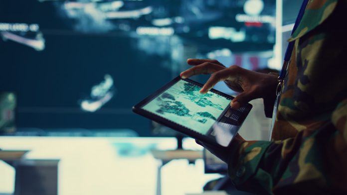 Army soldier reviews targets on satellite world map to ensure global protection افزایش سرعت و انعطاف پذیری در تولید با استفاده از فناوری دوقلوی دیجیتال